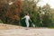 Woman skater rides a longboard on a track in the park. Photo in motion of a skateboard woman on a walk down the street on a sweat