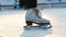 A woman skating on ice rink - slowing down