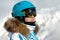 Woman in ski suit, helmet and sunglasses