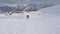 Woman Skier Accelerates Skiing On The Slope And Raises Her Hands Up