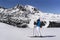 Woman skier enjoying peaceful and serene winter panorama in Grandvalira, Andorra