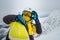 woman skier posing on the top of snowed mountain