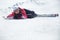 Woman skier resting at snowy ski piste
