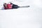 Woman skier resting at snowy ski piste