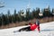 Woman skier with ski at winer resort in sunny day