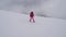 Woman Skier Skiing Down The Mountain Slope In A Heavy Fog