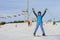 Woman skier skiing downhill at ski resort against ski-lift