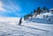 Woman skiing down the ski slope in Pyrenees Mountains, Andorra