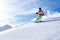 Woman is skiing in a winter paradise