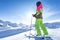 Woman is skiing in a winter paradise