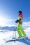 Woman is skiing in a winter paradise
