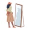 Woman in skirt looking in mirror in fitting room