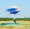 Woman - skydiver completes jump landing on accuracy