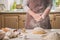 Woman slap his hands above dough closeup. Baker finishing his bakery, shake flour from his hands, free space for text.