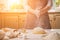 Woman slap his hands above dough closeup. Baker finishing his bakery, shake flour from his hands, free space for text.