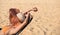 woman sleep or sunbathhing on the topical beach