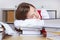 Woman sleeping on books