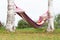 Woman sleeping in colorful hammock