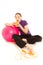 Woman with a slice of pizza, pink gymnastics ball