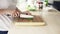 Woman slicing bazylia mint zioa chopping board