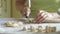 Woman is slicing a dough with a knife for making dumplings with cottage cheese, 4K close-up