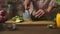 Woman slicing fresh healthy vegetables in the kitchen