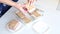 A woman is slicing homemade ice cream. She puts it on saucers. Making homemade ice cream