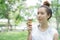 Woman sloppy from eating ice-cream cone. she happy and smile.