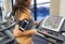 Woman with smartphone and earphones in gym