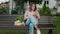 Woman with smartphone and string shopping bag