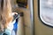 Woman with smartphone in subway. selected focus