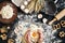 Woman smashes an egg using knife while kneading a pastry. Studio shot. Top view