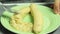 Woman smashing baked banana to make apple pie