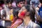 A woman smeared with colored powder, takes part in celebrations of the Dol Utsav Festival.