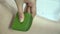 Woman smears a piece of aloe on her body. Apply aloe juice to the skin of your legs. SPA, moisturizing, eco, cosmetics, homemade.