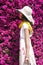 Woman smelling Bougainvillea blossoms Summer outdoor