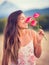 Woman smelling flowers in nature