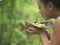 Woman Smelling Food On Leaf