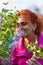 Woman smelling lilac outdoor