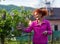 Woman smelling lilac outdoor