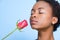 Woman smelling rose