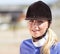 Woman smile, horse jockey and portrait of a young athlete on equestrian training ground for show and race. Outdoor