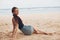 woman smile vacation beach sitting freedom sand coast travel nature sea