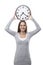 Woman smiles with a clock above her head