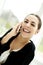 Woman smiling broadly talking on phone