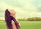 Woman smiling looking up to blue sky celebrating enjoying freedom