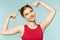 Woman smiling with perfect smile on the blue studio background