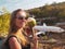 Woman smiling while posing over abandoned airplane in Bali