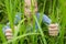 Woman sneaking through the grass.