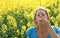 Woman sneezing because of allergy to pollen